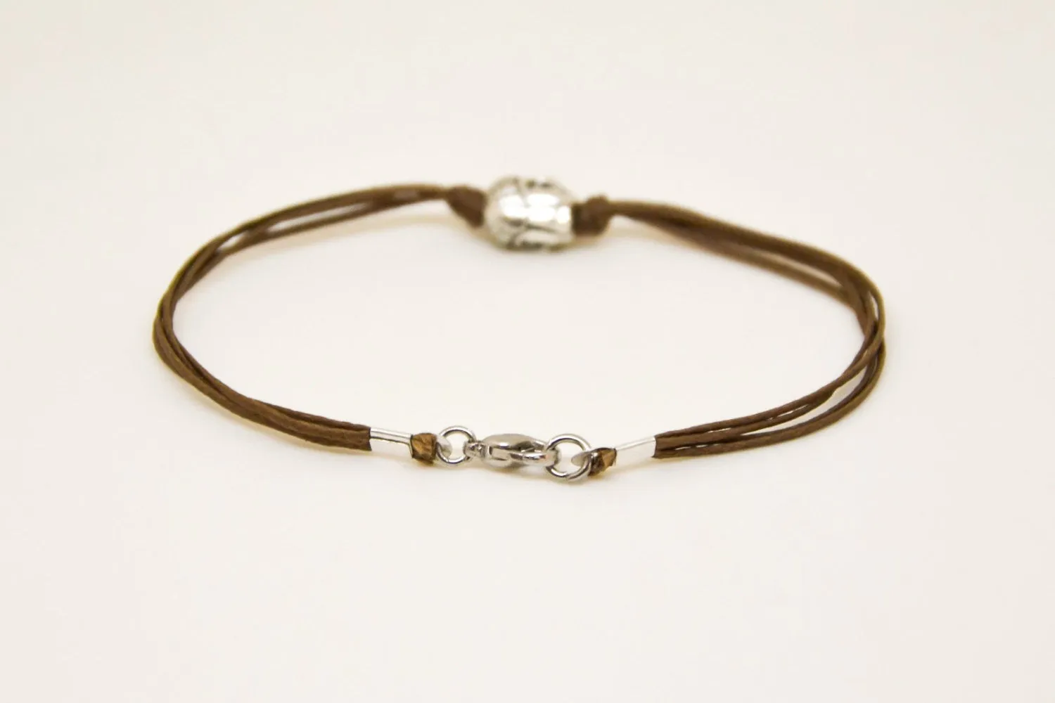 Men's bracelet with silver buddha charm, brown cord, yoga jewelry