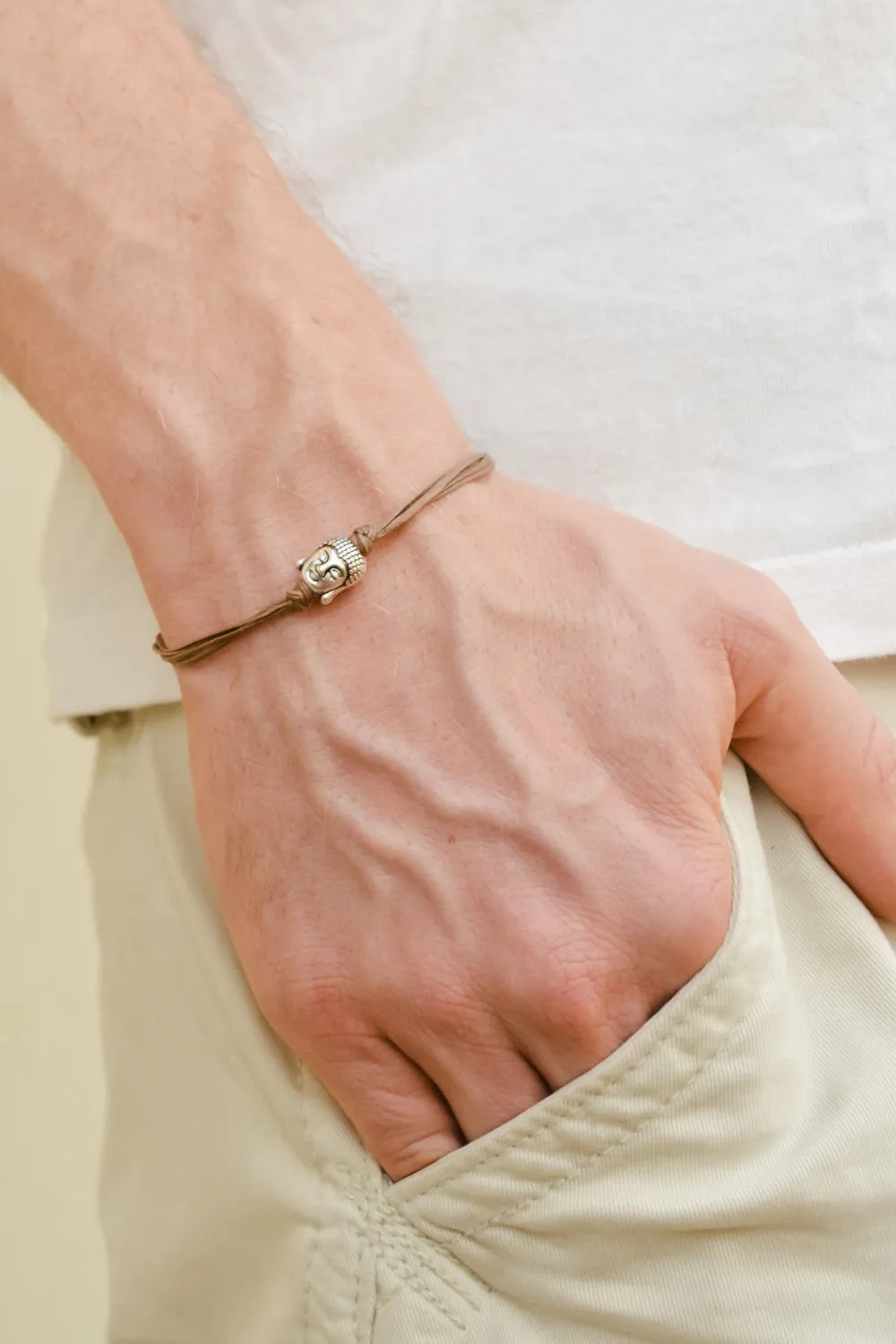 Men's bracelet with silver buddha charm, brown cord, yoga jewelry