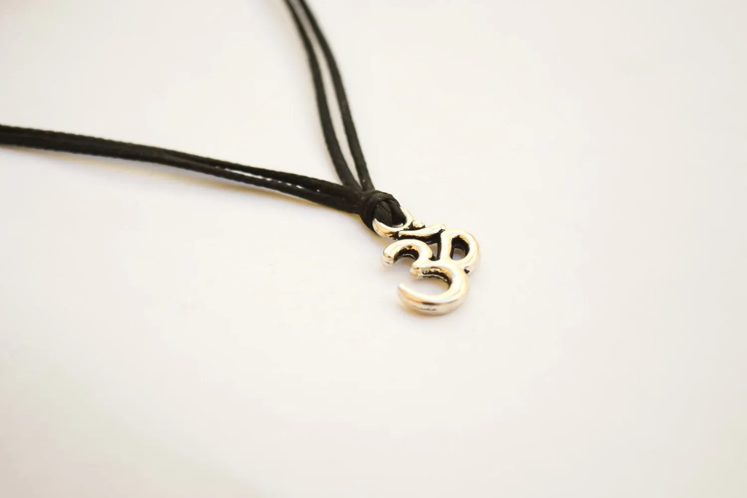 Silver Om necklace for men, black cord, handmade jewelry