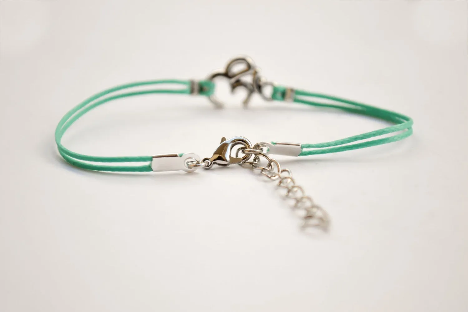 Turquoise cord bracelet with a silver Om charm, yoga jewelry