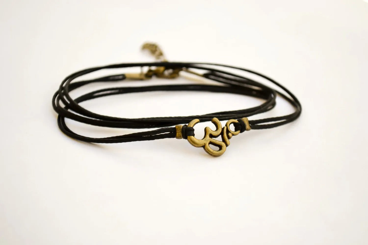 Wrapped bracelet with bronze tone Om charm, yoga jewelry for her