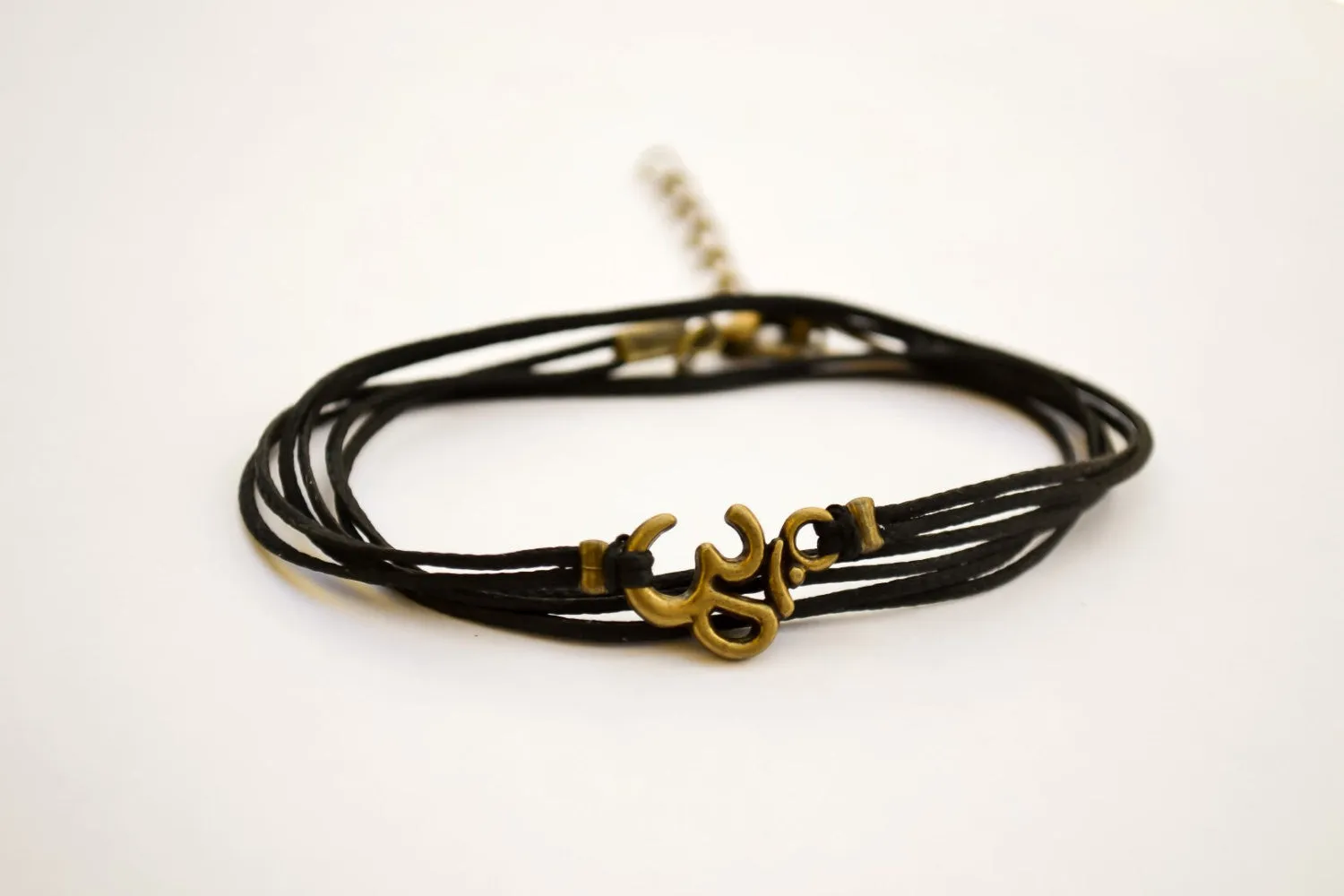 Wrapped bracelet with bronze tone Om charm, yoga jewelry for her