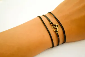 Wrapped bracelet with bronze tone Om charm, yoga jewelry for her